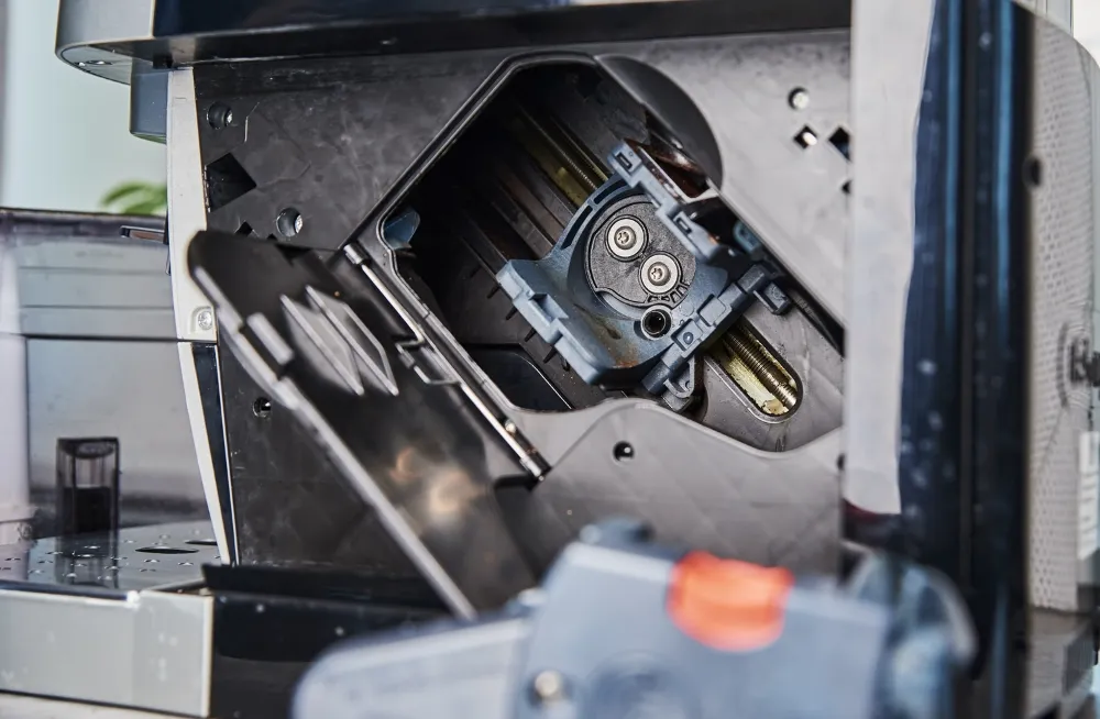 Coffee machine interior during preventive maintenance in Dubai.