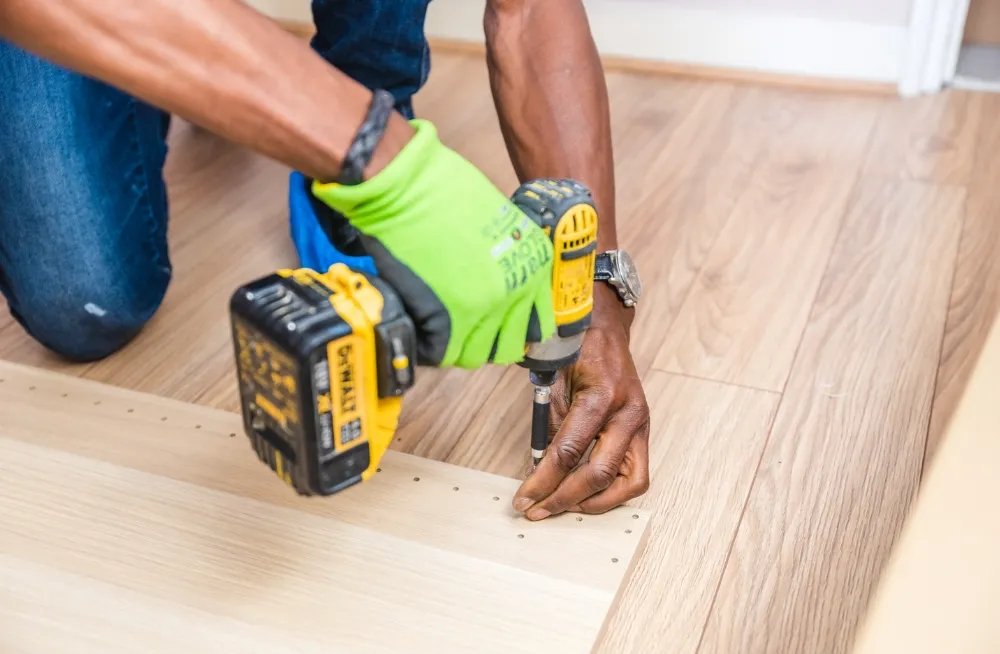 Handyman assisting customer with service booking in UAE