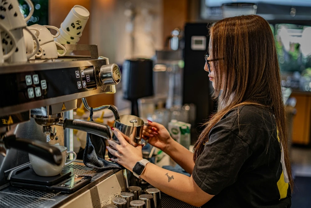 Technician repairing coffee machine components